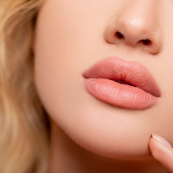 Beautiful lips Close-up. Makeup. Lip matte lipstick. Sexy lips.