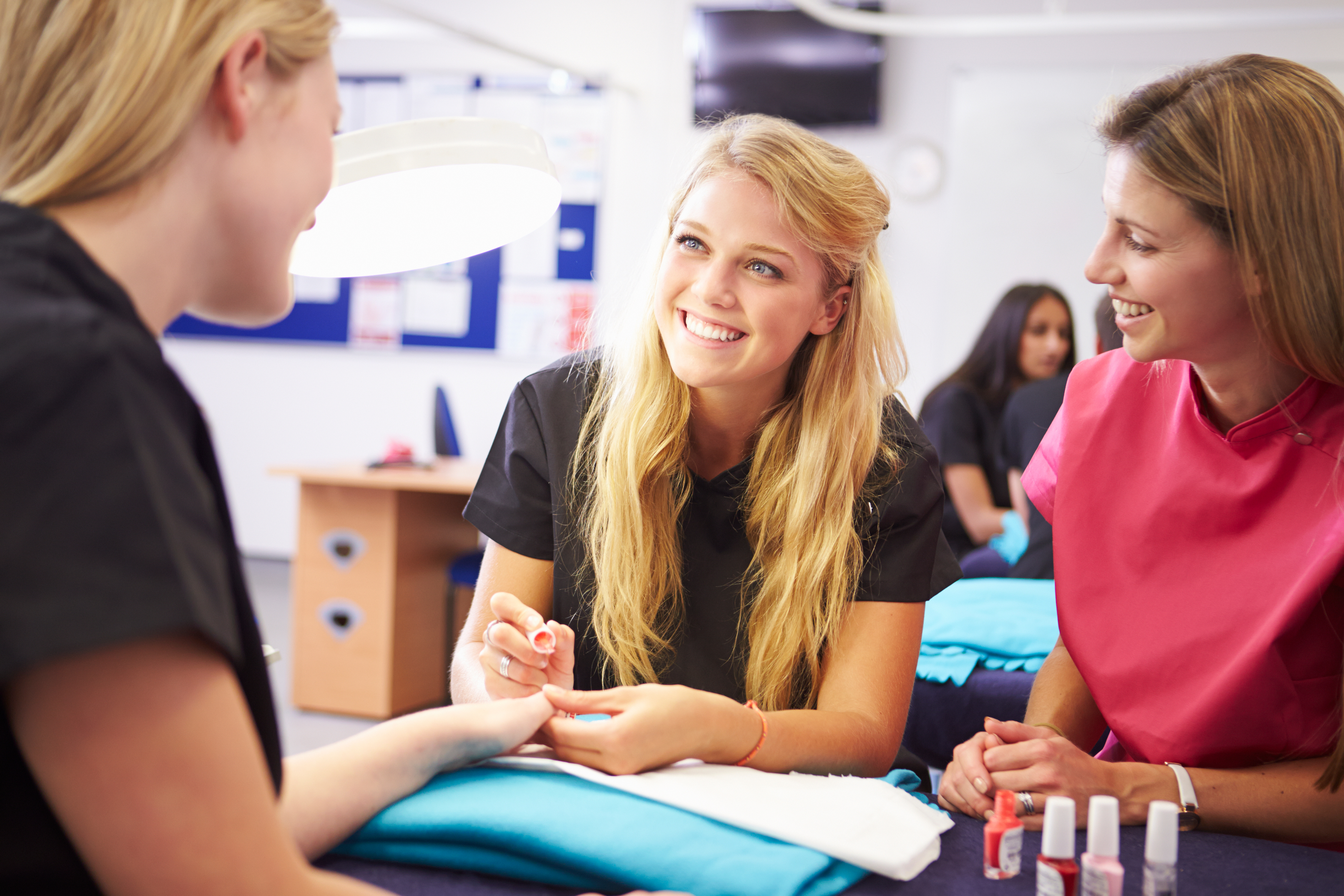 Teacher Helping Students Training To Become Beauticians AdobeStock 84479385